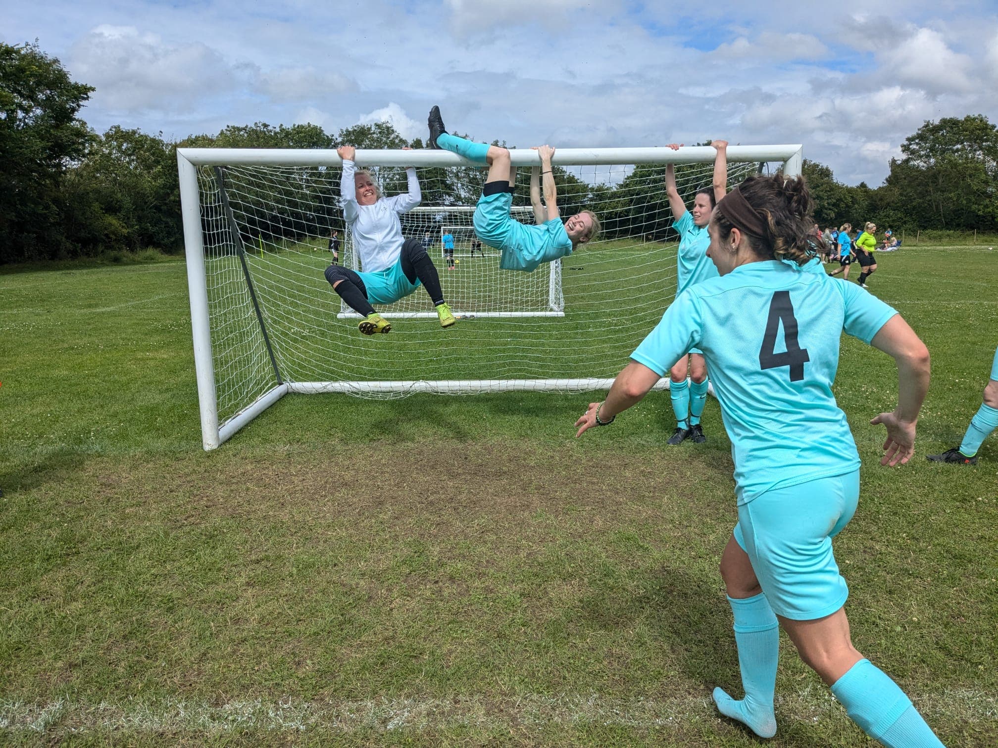 Players hanging off the crossbar after a win