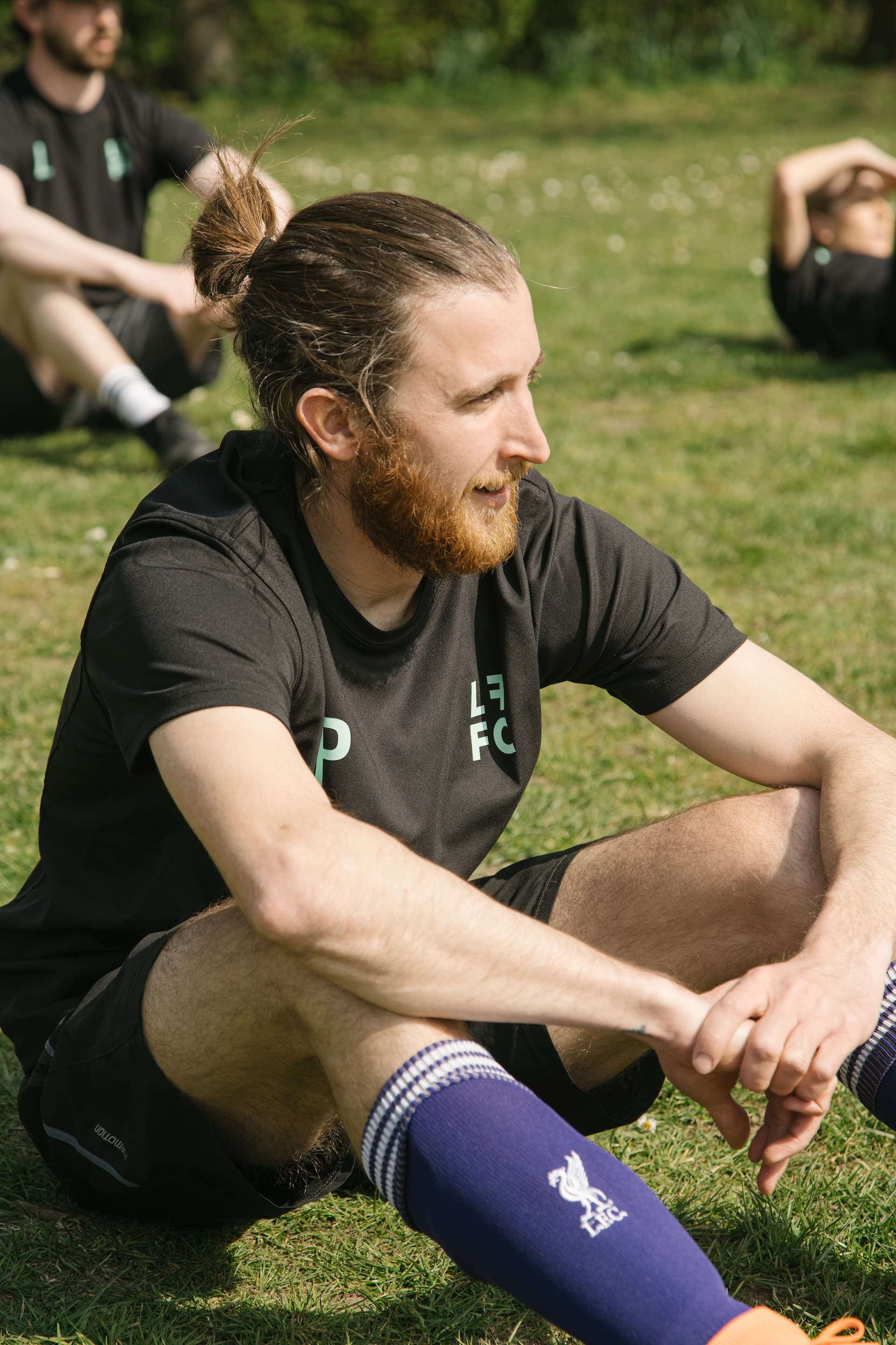 The club crest on the front of a black training shirt